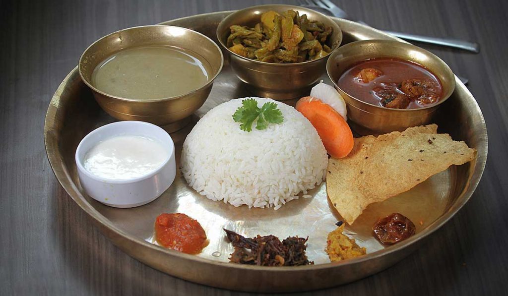 Traditional Nepali dal bhat meal served in a teahouse during a Himalayan trekking journey in Nepal