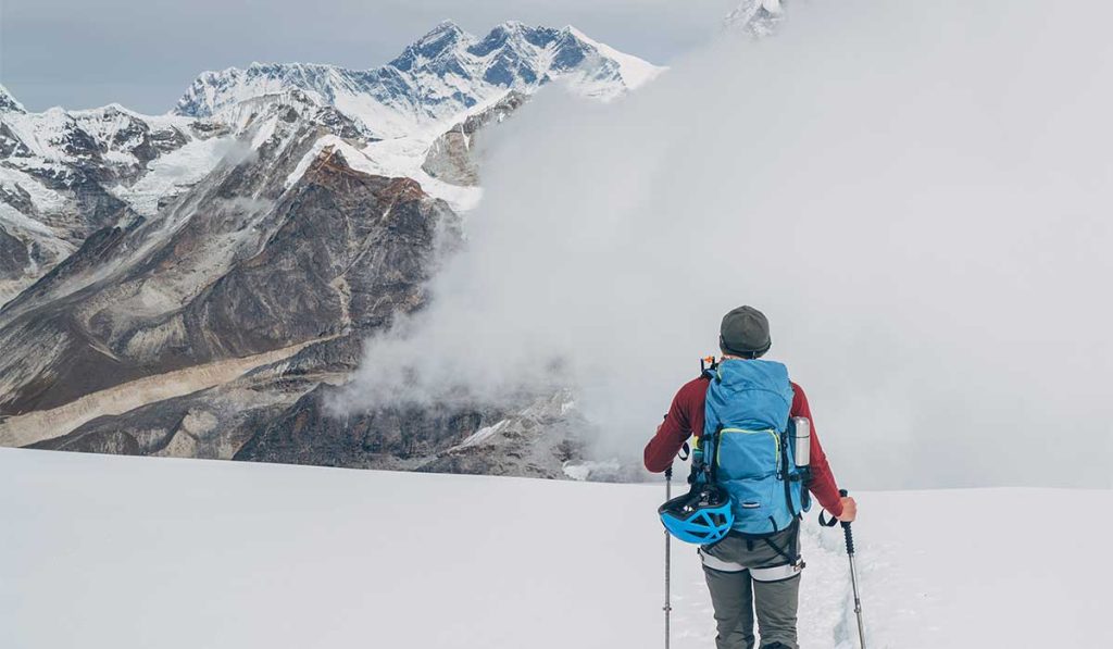 A trekker on the Manaslu trail. Become fit through planned training to able to hike here.