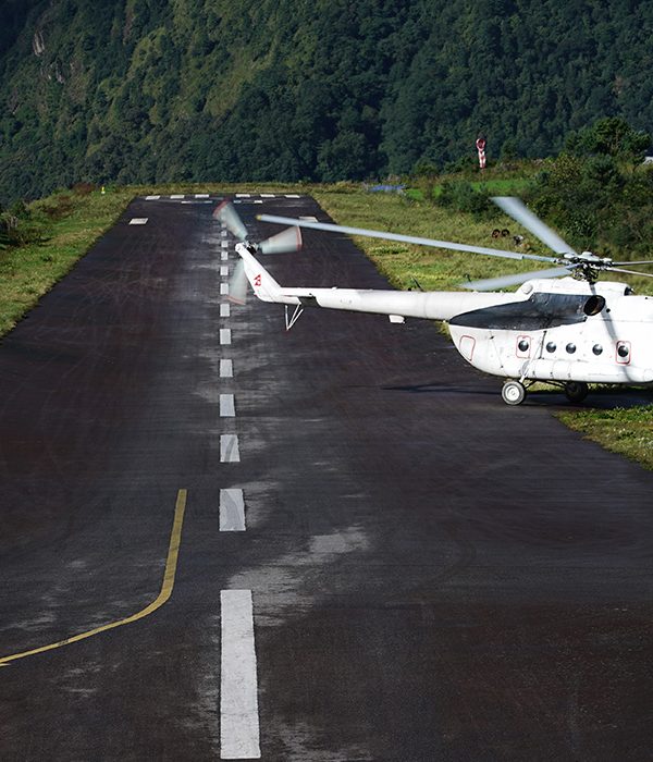 helicopter landing on runway at tenzing