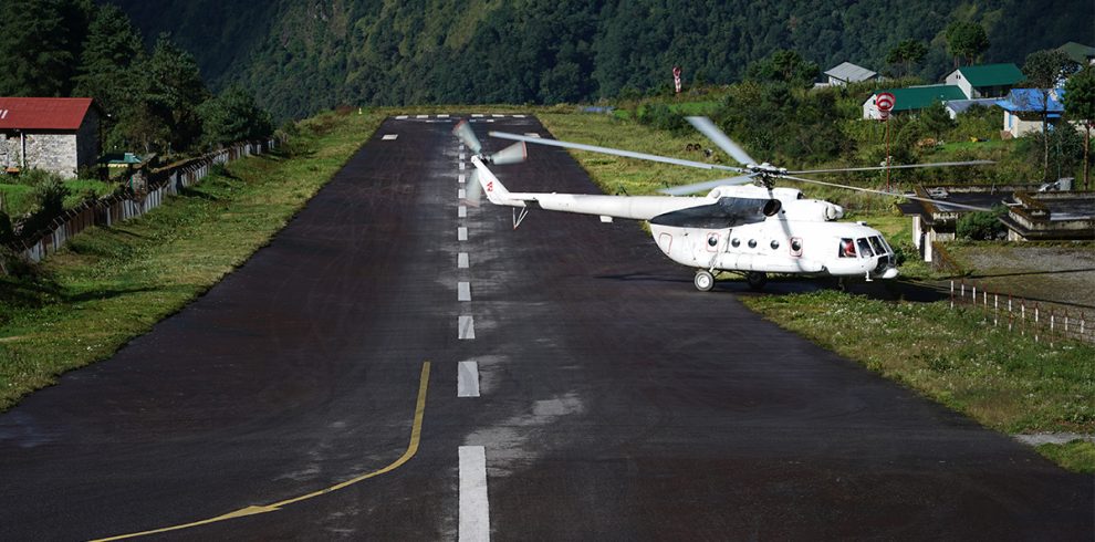 helicopter landing on runway at tenzing