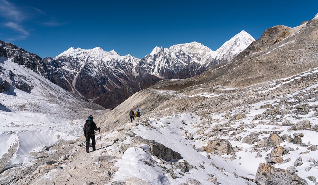 People trekking along the trail in the Manaslu region